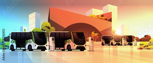 electric buses charging battery vehicles at recharging power station charger EV management sustainable transport concept