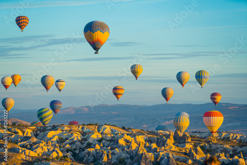 what a wonderful sunrise - air balloons floating in the blue sky over Cappadocia. High quality photo