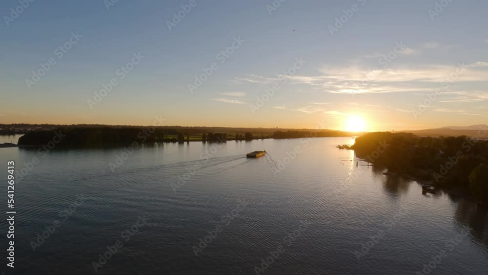 Fraser River View during a colorful sunset. Aerial View taken from Golden Ears Bridge, in Pitt Meadows, Greater Vancouver, British Columbia, Canada. Slow Motion Cinematic Pan Fraser River View during a colorful sunset. Aerial View taken from Golden Ears Bridge, in Pitt Meadows, Greater Vancouver, British Columbia, Canada. Slow Motion Cinematic Pan