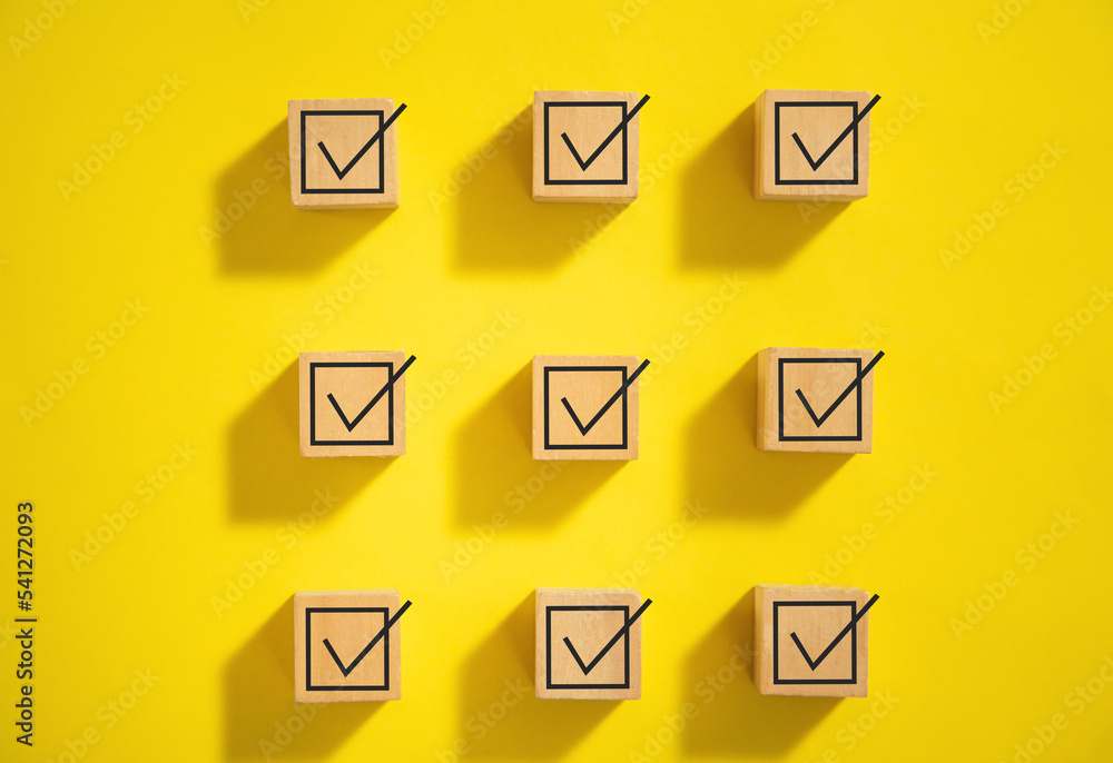 Checkbox on wooden cubes. Business concept