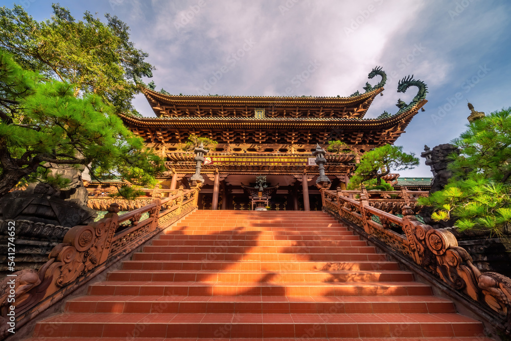 Fototapeta premium view of Minh Thanh pagoda, a majestic Buddhist architectural structure in Pleiku city, Gia Lai province, Vietnam, text in photo mean peace, compassion, forgiveness. Travel concept