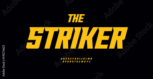 High bold italic font sharp serif alphabet yellow tall letters. Dynamic headline and purposeful logo for sportswear, racing, hunting, fishing, shooting, sport, airsoft, hiking. Vector typography