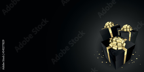 Black Gift boxes with a gold bow design banner - Christmas and birthday present background