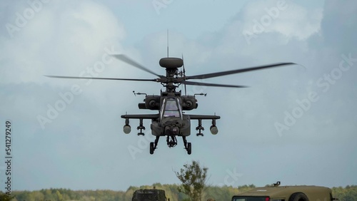 close-up head-on view of ZM707 British army Boeing Apache Attack helicopter gunship (AH64E AH-64E ArmyAir606) taking off  photo