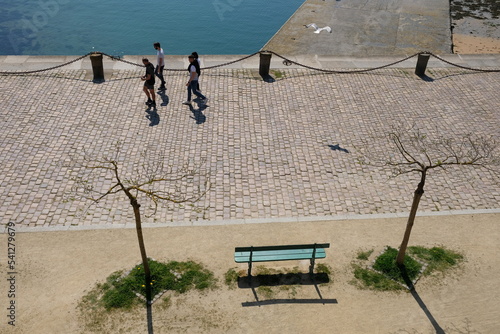 People walking along the sea 