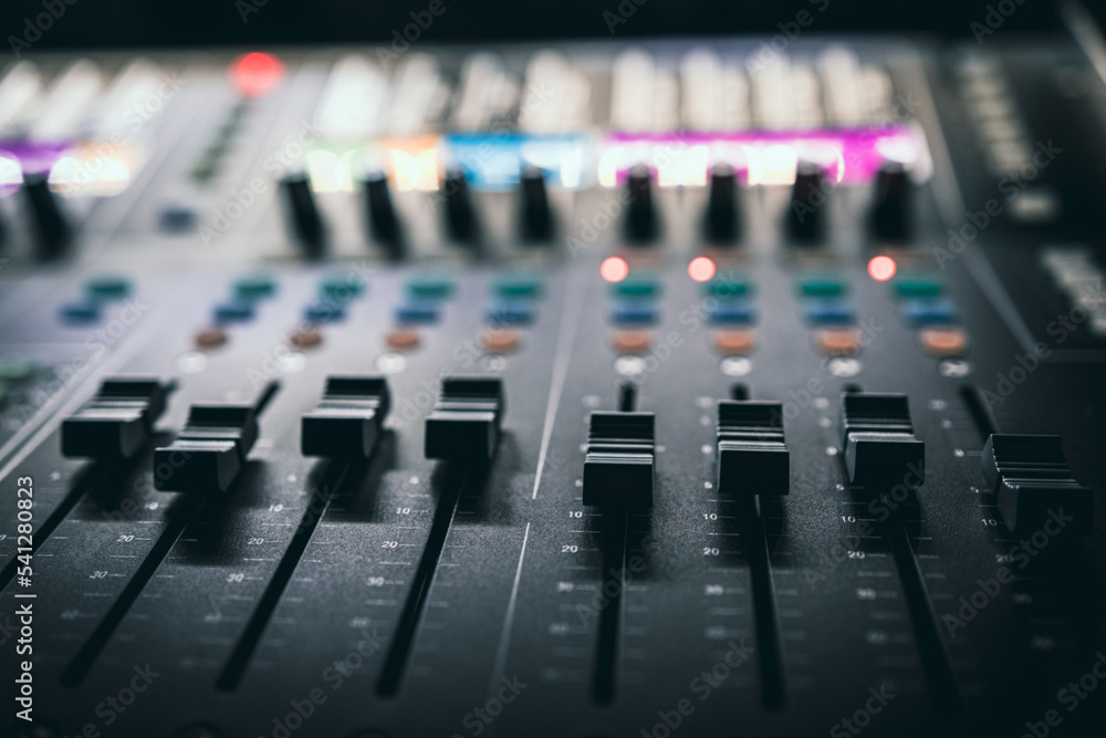 Sound control music mixer in record studio. Close up mixer and equalizer volume on the mixer amplifier. Digital audio system Sound control music mixer in record studio. Close up mixer and equalizer volume on the mixer amplifier. Digital audio system