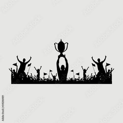 silhouette of a group of people lifting a trophy after winning the championship