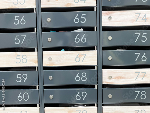Metal mailboxes with numbers. Apartment numbers on mailboxes.