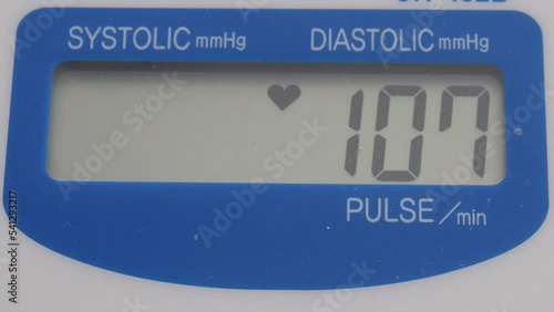 Slightly high blood pressure of 140, 85 on a digital sphygmomanometer screen, lifelong illnesses, large expenses for health services and medical insurance. Heart disease concept photo