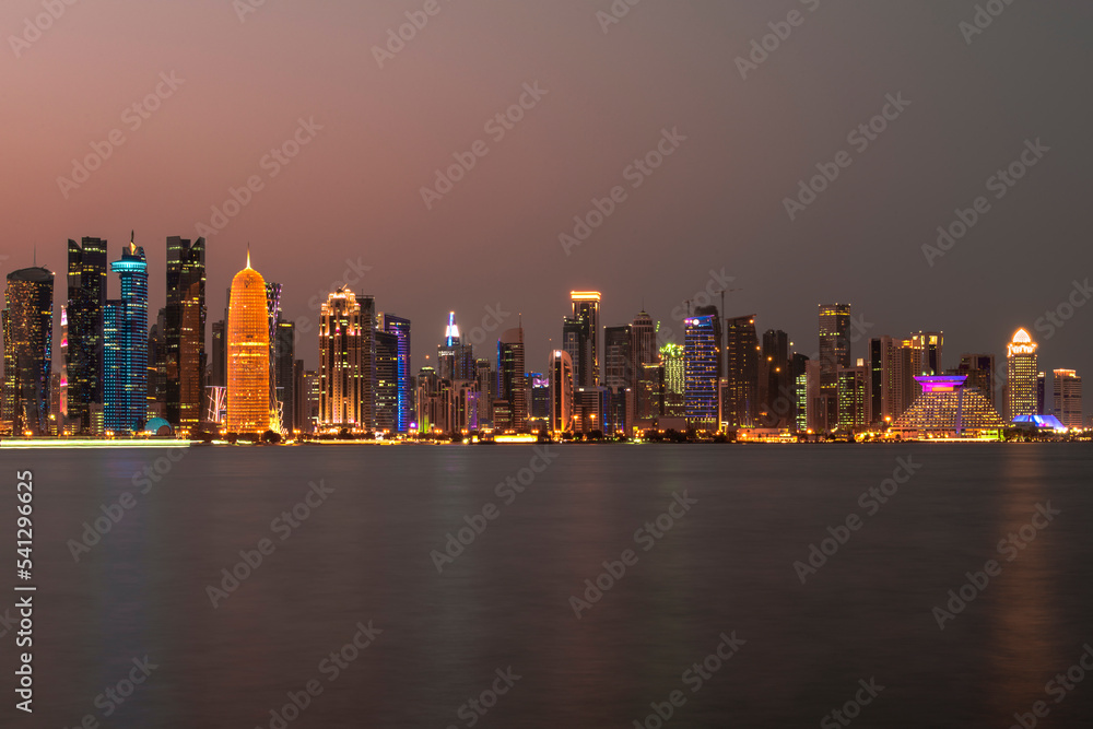 Naklejka premium Doha, Qatar- December 23,2019 : Night view of Skyline, Doha's Financial District (West Bay).