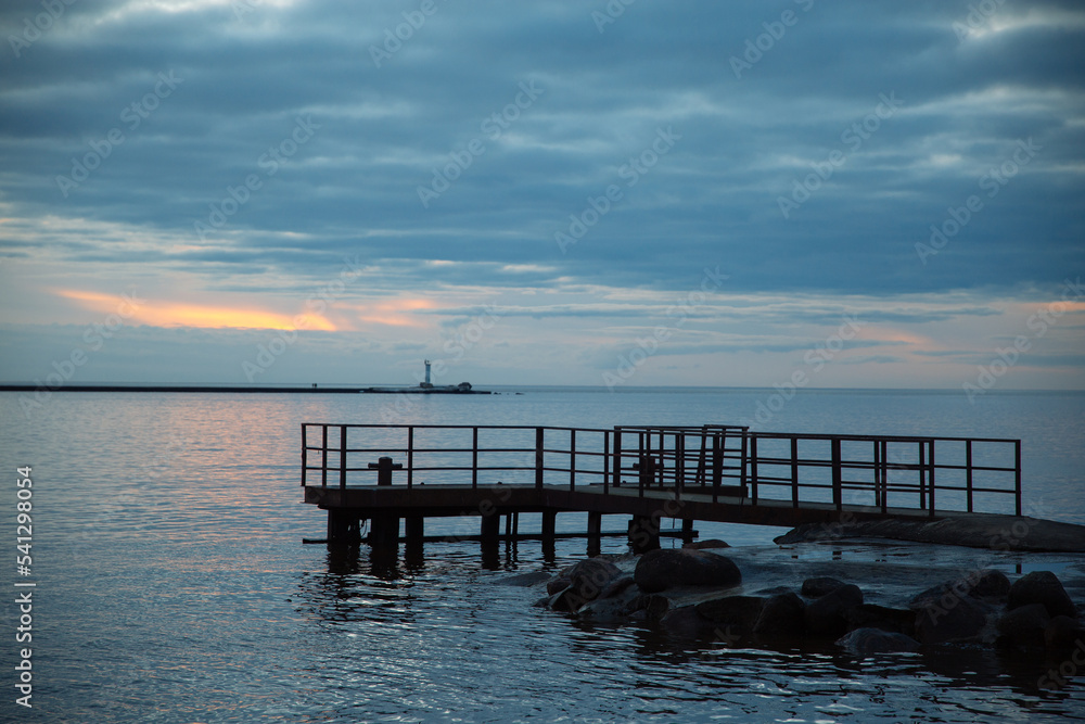 Pier platform in the sea, cloudy sunset, background image