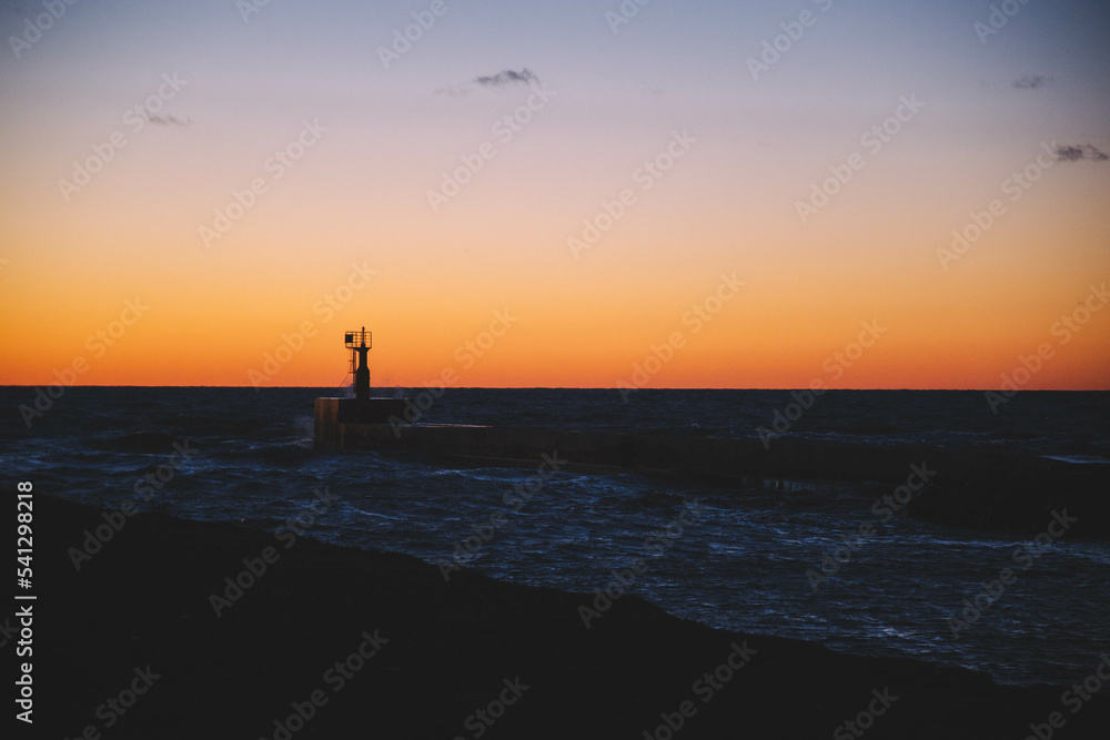 sea pier in the sunset, splashing waves, beautiful landscape, neutral background, harbor dock 
