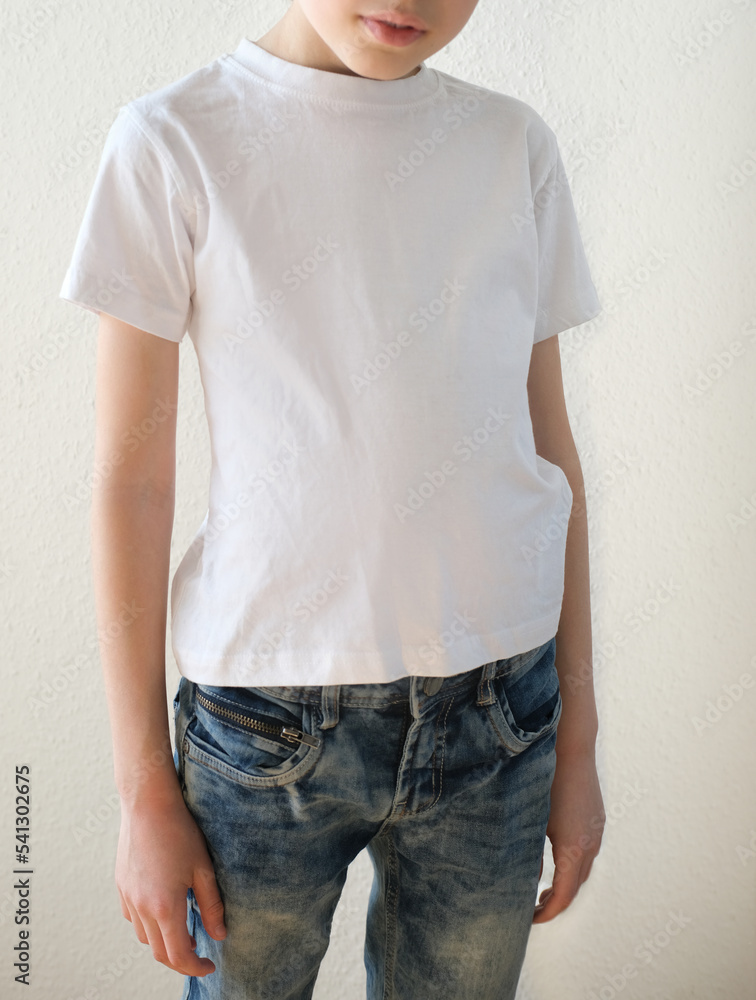 part of boy, child 10 years old in white t-shirt is standing in front, good posture, prevention of scoliosis in childhood, concept of hearing health, happy childhood, mocap for designer part of boy, child 10 years old in white t-shirt is standing in front, good posture, prevention of scoliosis in childhood, concept of hearing health, happy childhood, mocap for designer