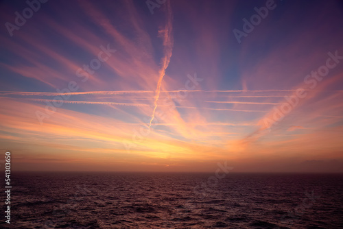 Dramatic Colorful Sunrise Sky over North Atlantic Ocean. Cloudscape Nature Background.