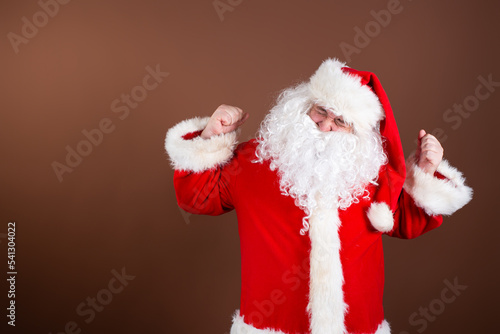 Luck. Lucky Santa Claus poses in the studio. Winning the quiz.