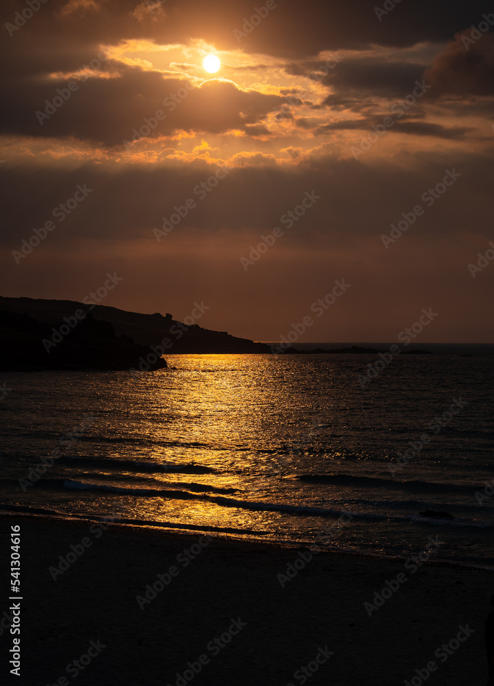 The sun setting over the headland off Saint Ives