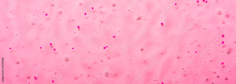 Cosmetic gel close-up with oxygen bubbles. Textured background with microbrushes in cosmetics. Moisturizing skin serum with vitamins and collagen.