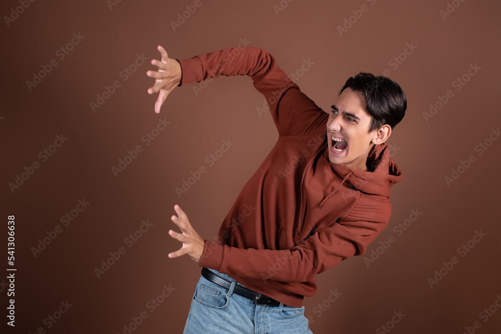 Frightened guy posing in a photo studio. Fear and horror. Frightened guy posing in a photo studio. Fear and horror.