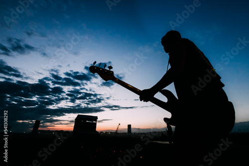 Bild auf Leinwand Silhouette of a guitar player on stage