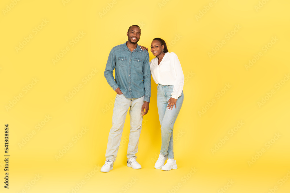 Full Length Of African American Couple Posing Over Yellow Background Full Length Of African American Couple Posing Over Yellow Background