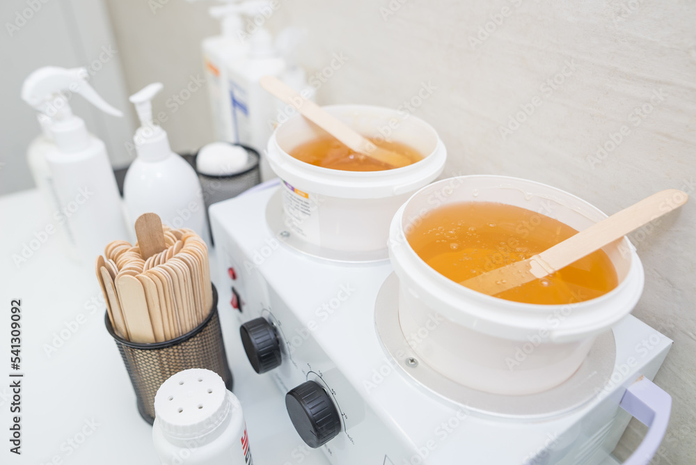 Plastic bucket with sugar paste for shugaring. Plastic bucket with sugar paste for shugaring.