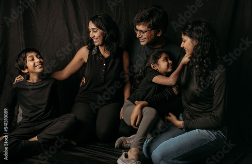 A Blended Family portrait dressed in black 