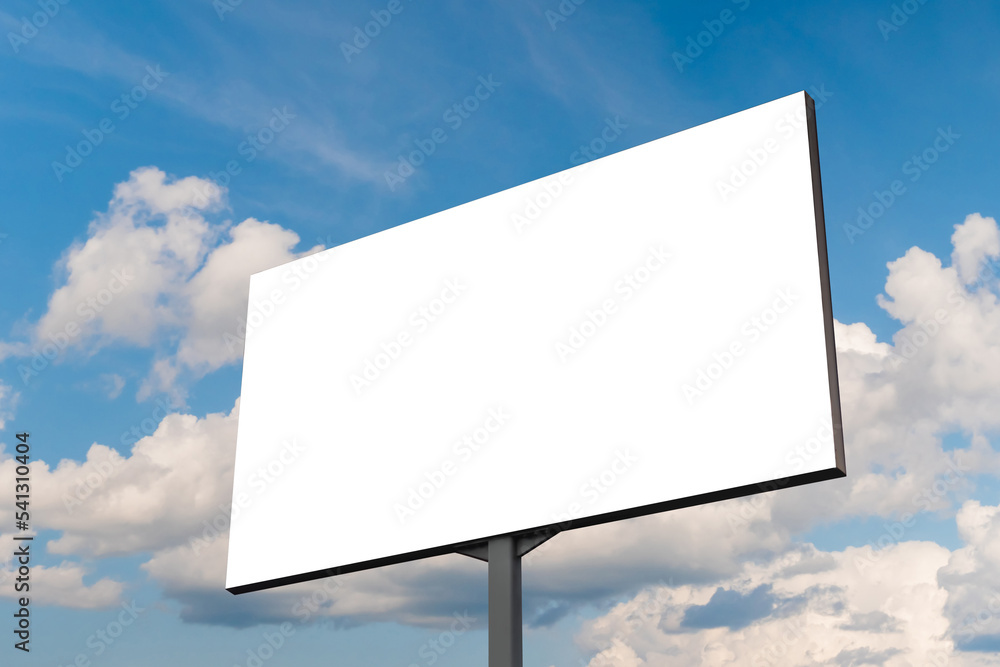 Blank white billboard or large display against blue sky with white clouds - mock up. White screen, consumerism, advertising, template, copy space and mockup concept