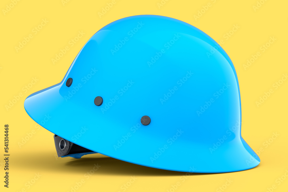 Fototapeta premium Blue safety helmet or hard cap isolated on yellow background