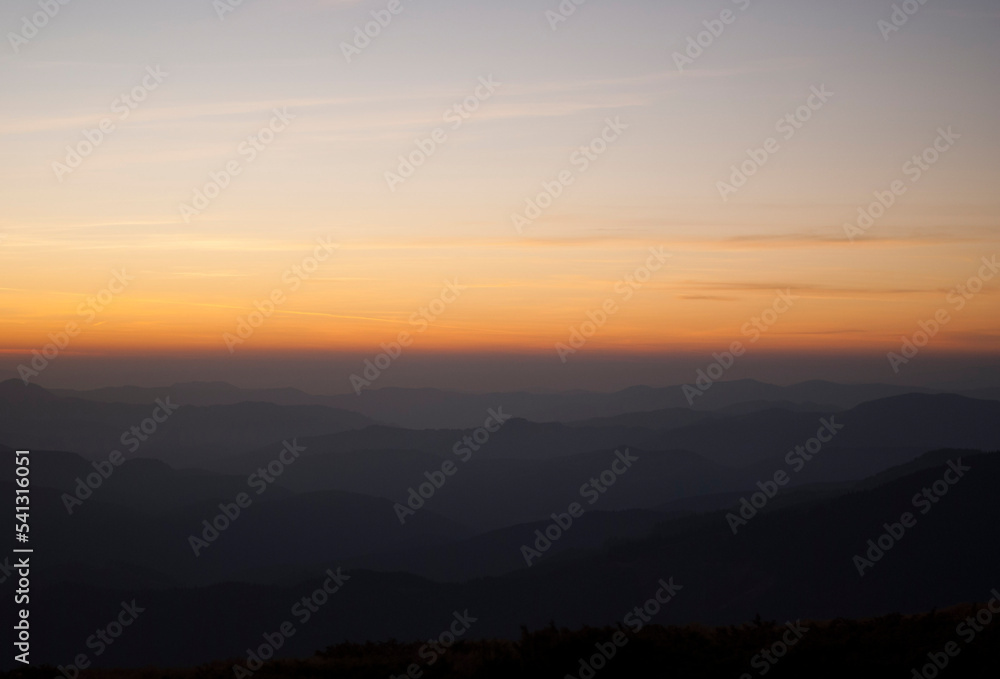 View on mountains by the lights of sunset