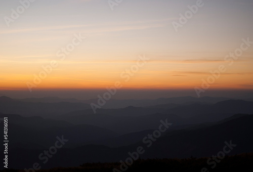 View on mountains by the lights of sunset