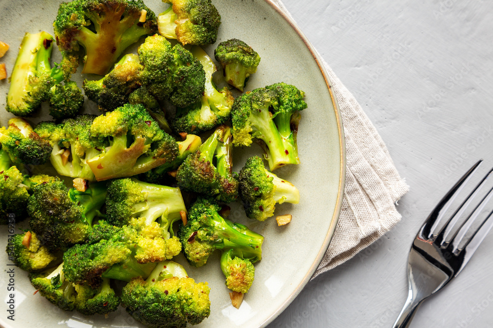 Homemade Pan-Fried Broccoli on a Plate, top view. Flat lay, overhead, from above. Close-up. Homemade Pan-Fried Broccoli on a Plate, top view. Flat lay, overhead, from above. Close-up.