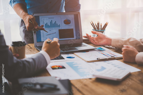 Photography Financial analyst analyzes businessman investment consultant analyzing company financial report balance sheet statement working with documents graphs