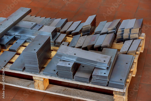 Laser cutting of sheet metal at the factory. Storage of finished parts on a pallet.