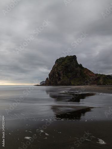 Lion rock at Piha Beach with the reflection.