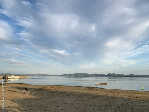 Trasimeno lake view from Castiglione del Lago in Umbria, Italy. View of Lake Trasimeno from Castiglione del Lago in early autumn. Umbria, Italy. Trasimeno lake panoramic view, Umbria, Italy.