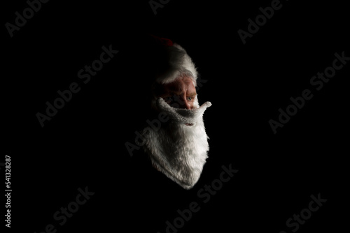Fototapeta Naklejka Na Ścianę i Meble -  A fake Santa giving a serious look just off camera.