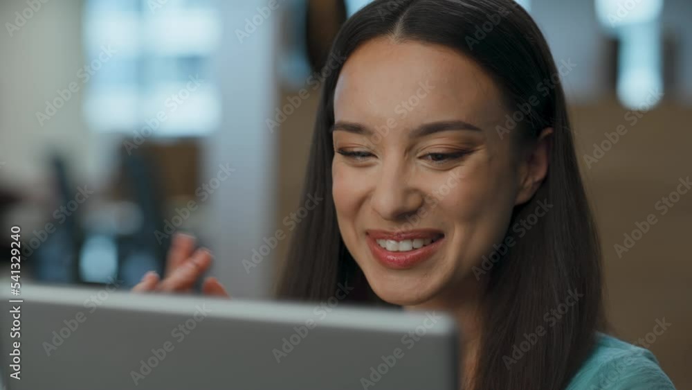 Happy hr manager waving hello to tablet screen lobby. Woman holding video call Happy hr manager waving hello to tablet screen lobby. Woman holding video call