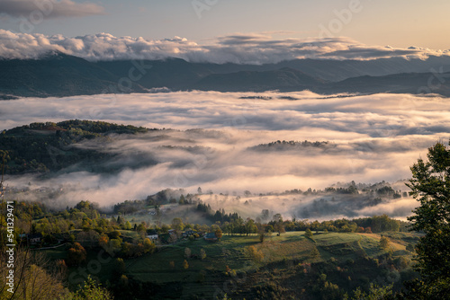 Sunrise in the fog over the mountains in autumn © Marc Andreu