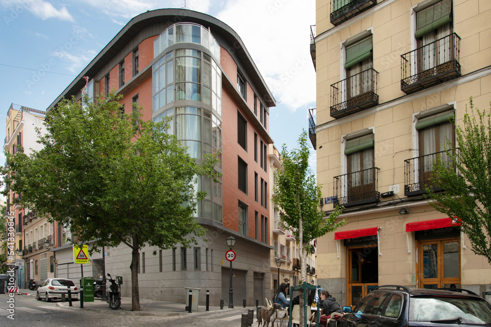 Facades of houses in the city center with terraces for recreation in the bars in the area
