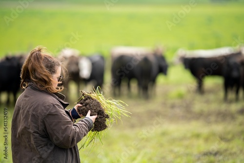 female in agriculture, soil science. agronomy on a ranch growing grass