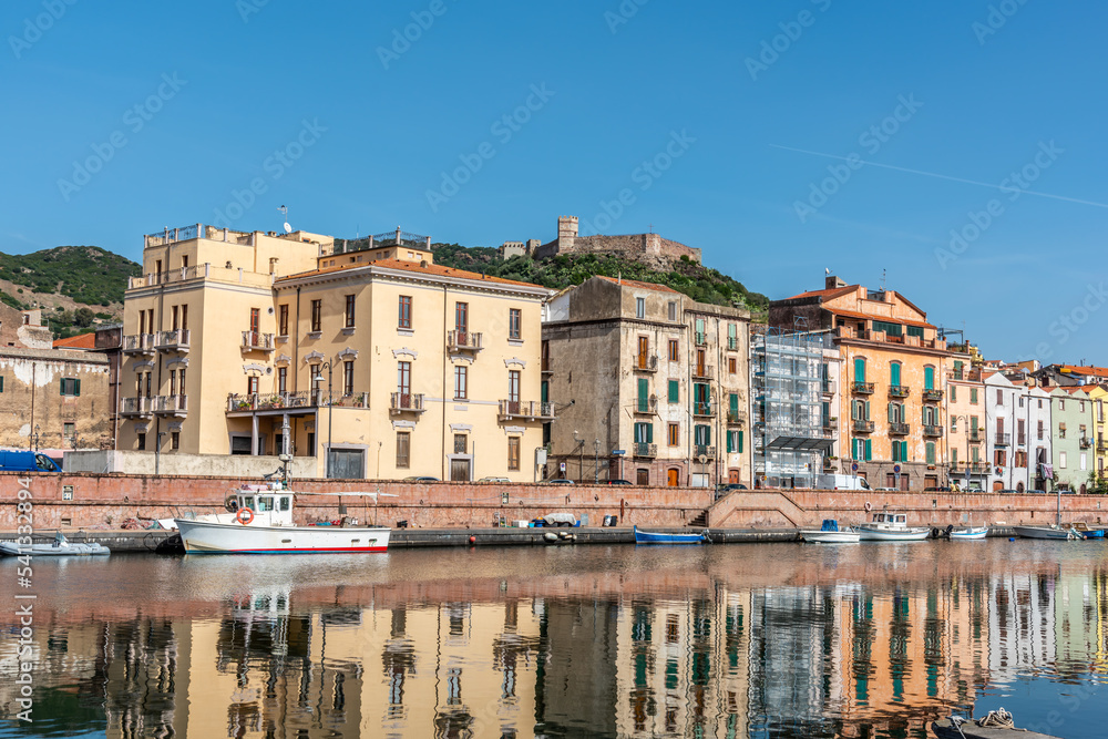 Old buildings by Temo river reflected on the water