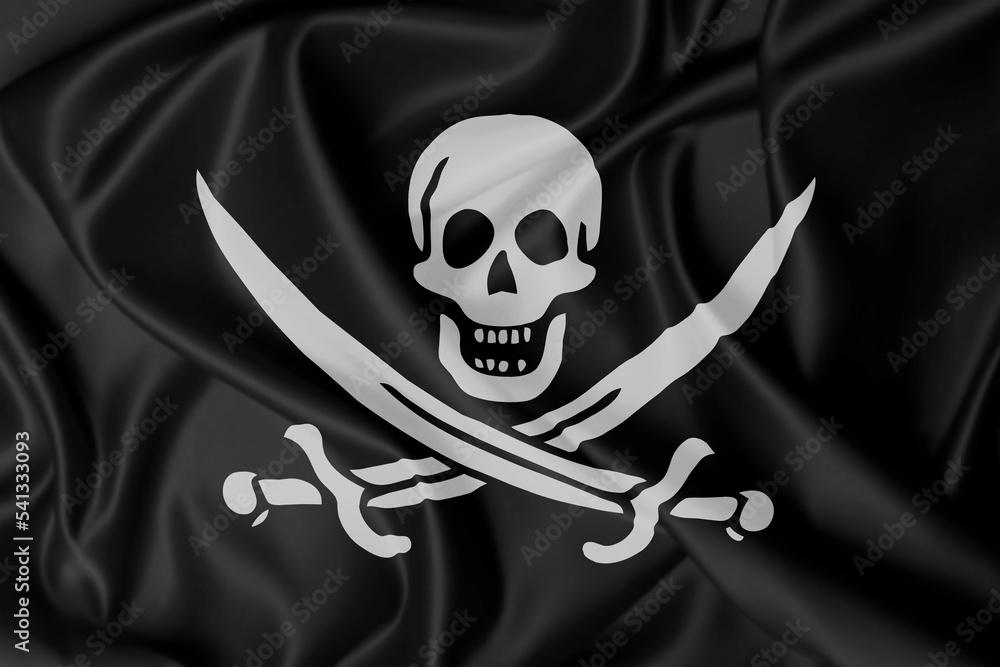 Black pirate flag with a skull and swords on a silk texture waving in ...