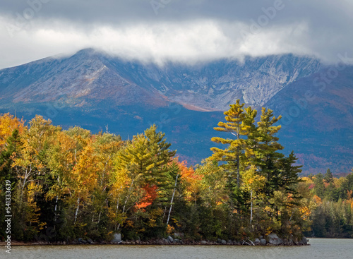Baxter Peak view surrounded by moody clouds from Lake Katahdin  Maine  in early fall
