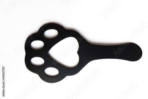 Sex toys. BDSM. Slap for ass. in the shape of a paw. The concept of pain and pleasure. Insulated on white.