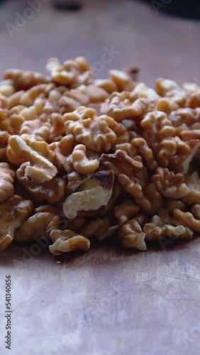 fresh walnuts on a rustic wooden board
