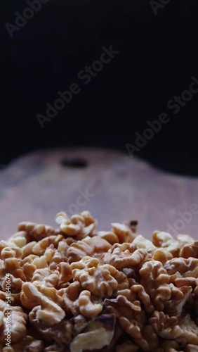 fresh walnuts on a rustic wooden board