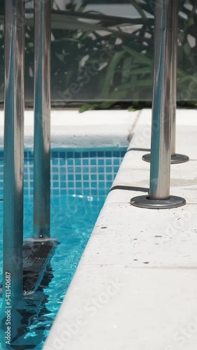 woman legs walking towards pool a sunny day	