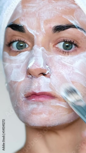 woman applying a skin care mask	