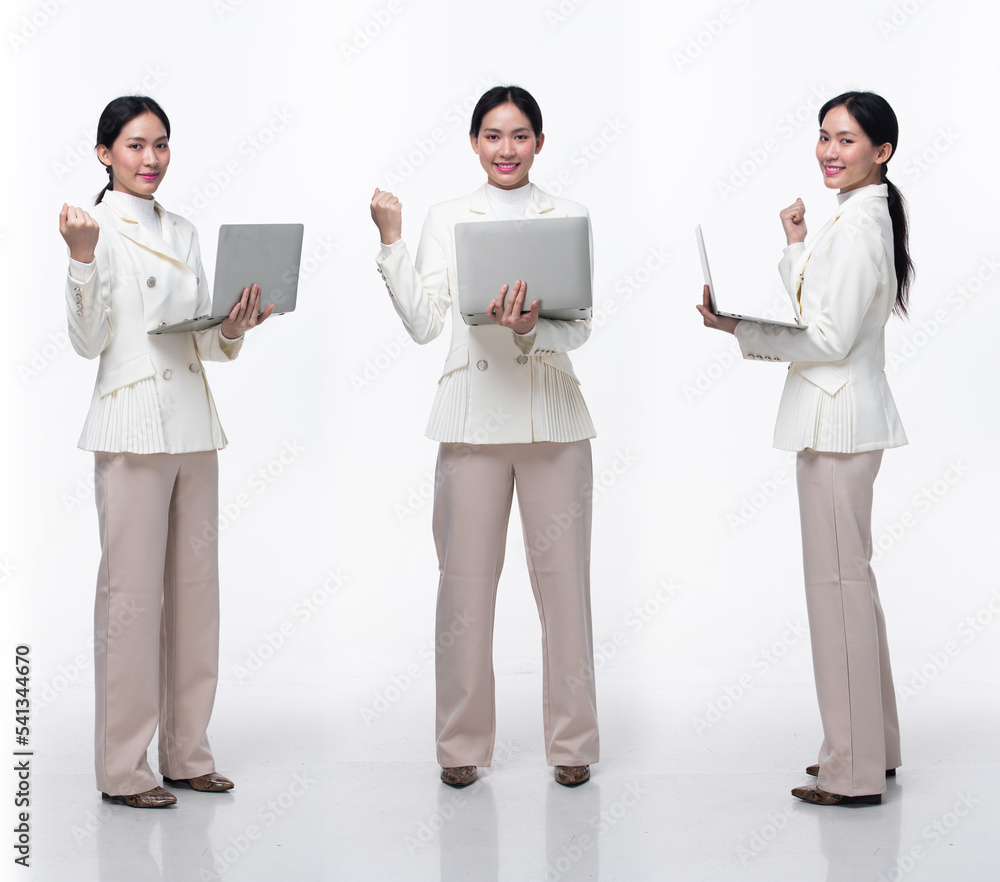 Full length 20s Asian Woman wear formal business blazer suit dress pant shoes. Black long straight hair female hold laptop work confident, happy success sigh, white background isolated Full length 20s Asian Woman wear formal business blazer suit dress pant shoes. Black long straight hair female hold laptop work confident, happy success sigh, white background isolated