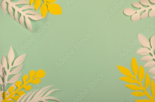 light green background with white and yellow sheets of paper